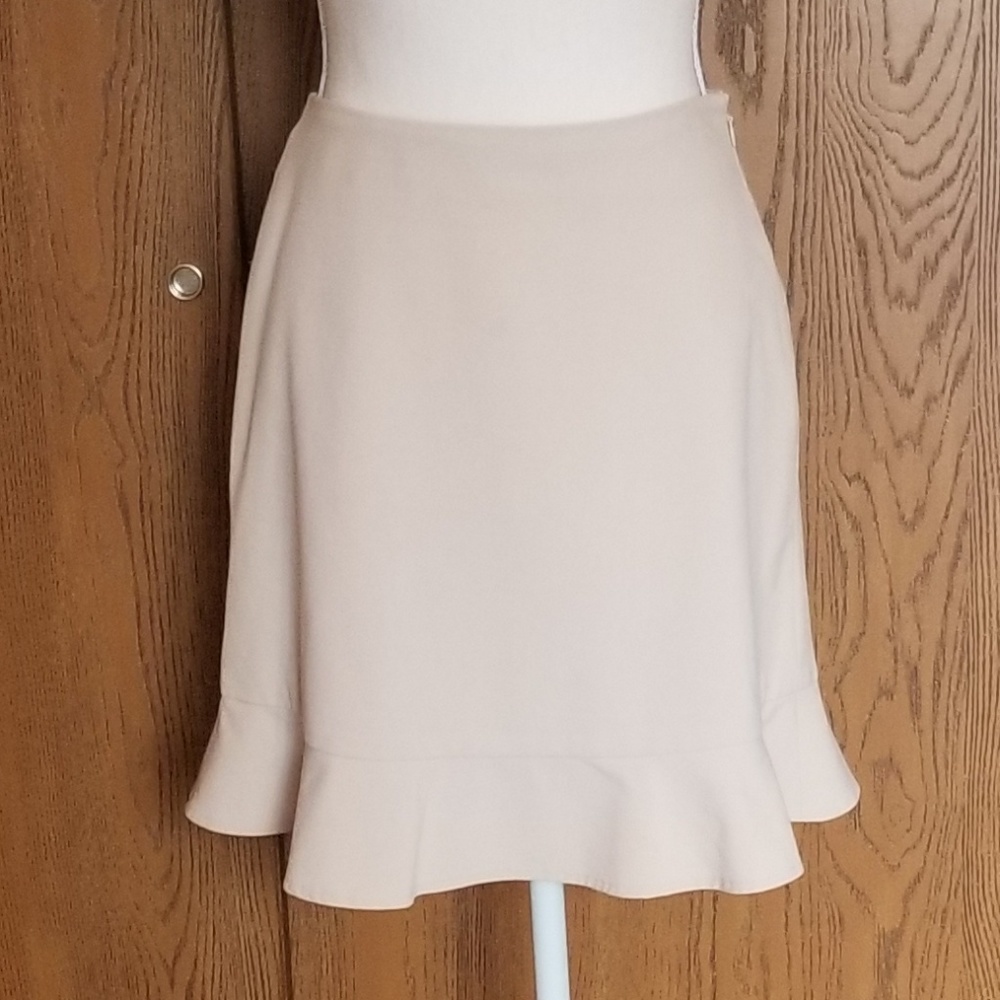 The limited tan mini skirt